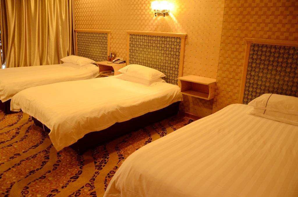 Omeiga Business Hotel Yiwu (Zhejiang) Oda fotoğraf