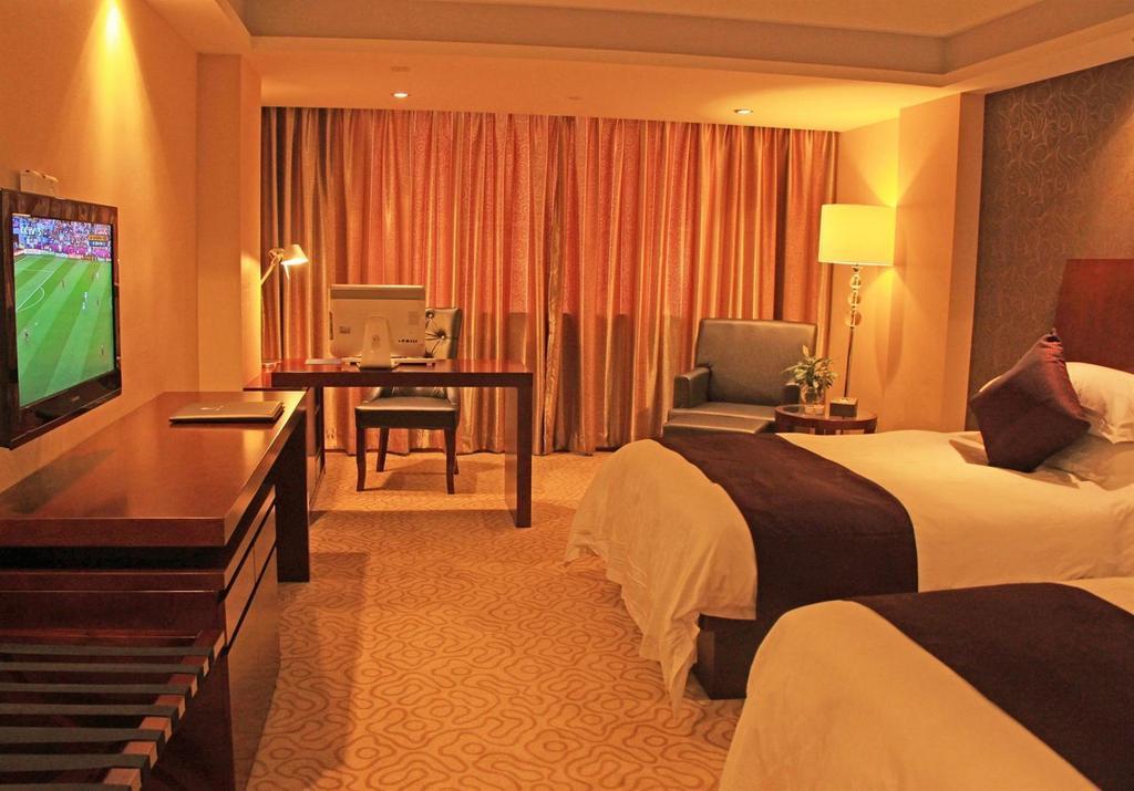 Omeiga Business Hotel Yiwu (Zhejiang) Oda fotoğraf